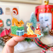 Load image into Gallery viewer, Cheshire, Mochi, Figaro, &amp; Oliver Christmas Wreath &amp; Presents Transparent Sticker
